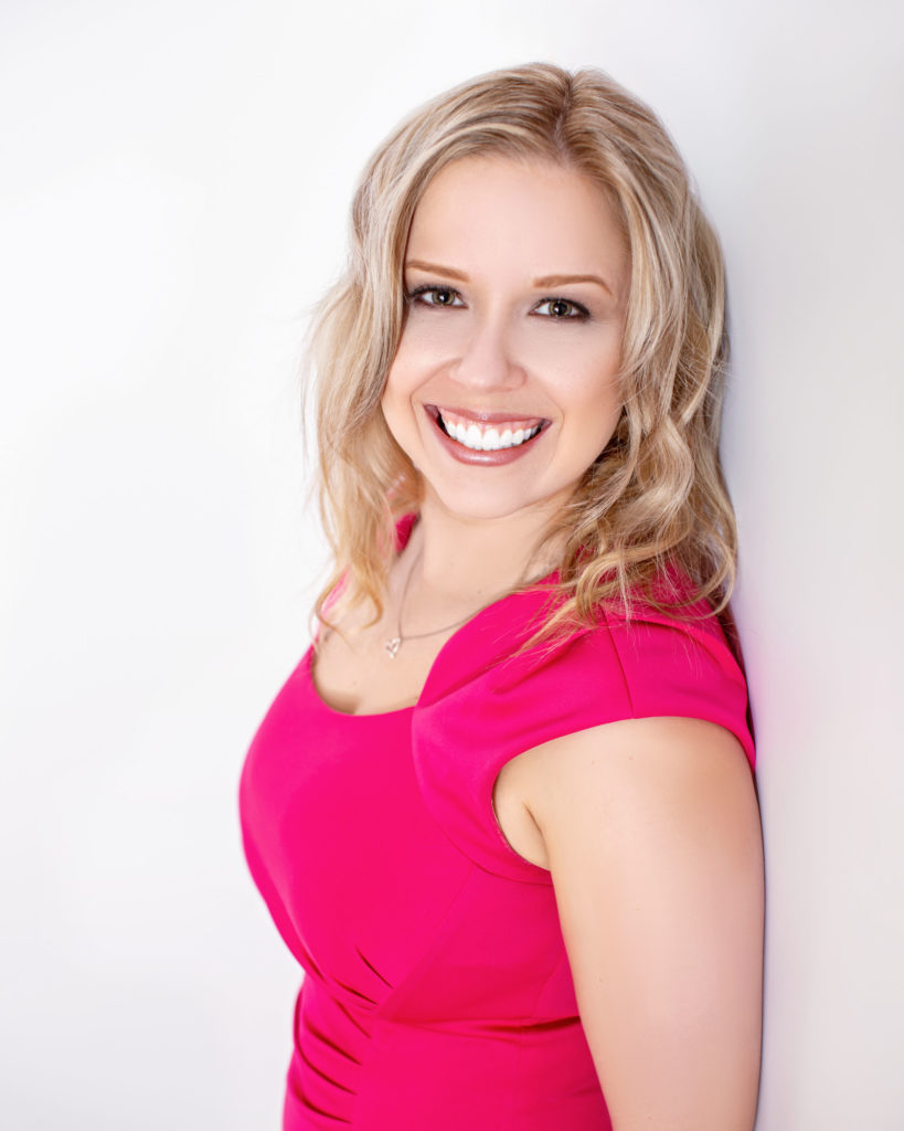 Celebrating Local Women In Business Featuring Sarah Doyle Headshot Pink Dress Smiling